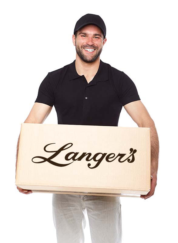 Goldbelly delivery guy with a gift box from Langer's