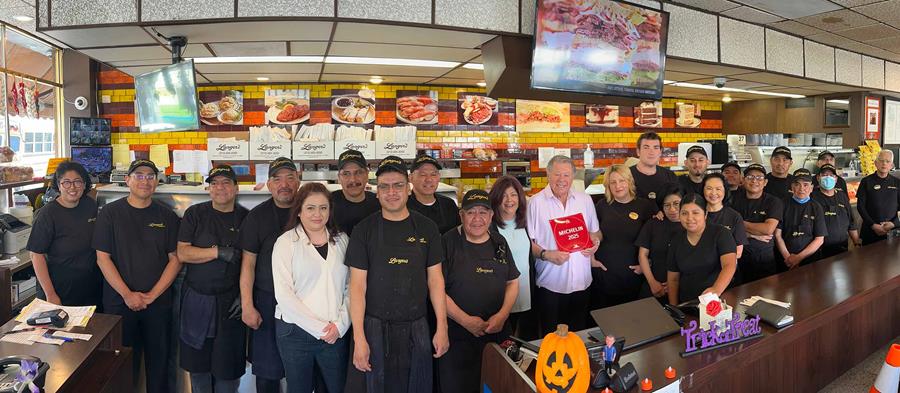 Norm and Jeannette Langer with their 2025 Michelin Bib Gourmand Award along with the Langer's team